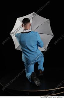 03 2018 01 MIKAEL KNEELING POSE WITH UMBRELLA